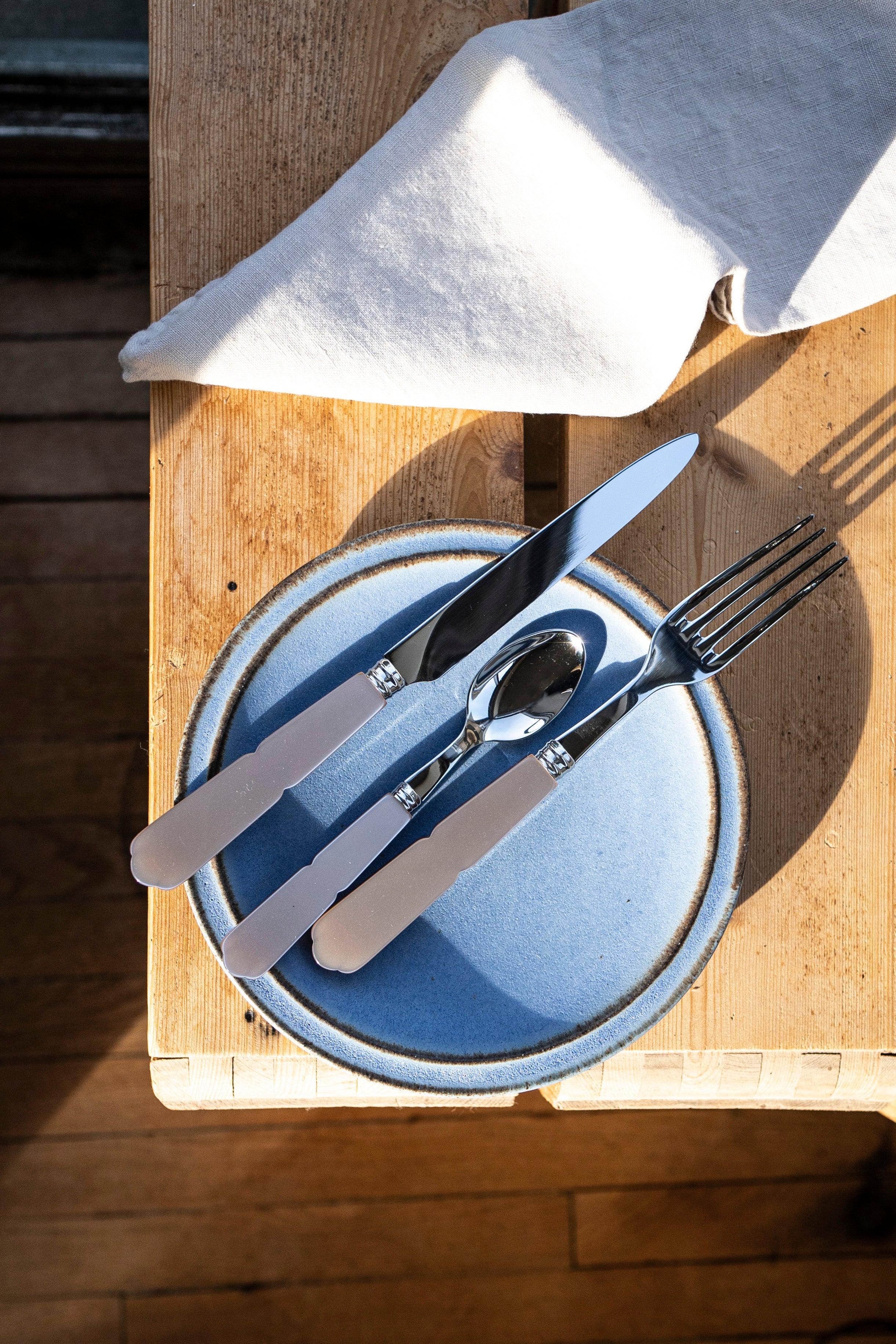 A stylish set of 5 Sabre cutlery from Paris, including a spoon, fork, and knife, perfect for any table setup.