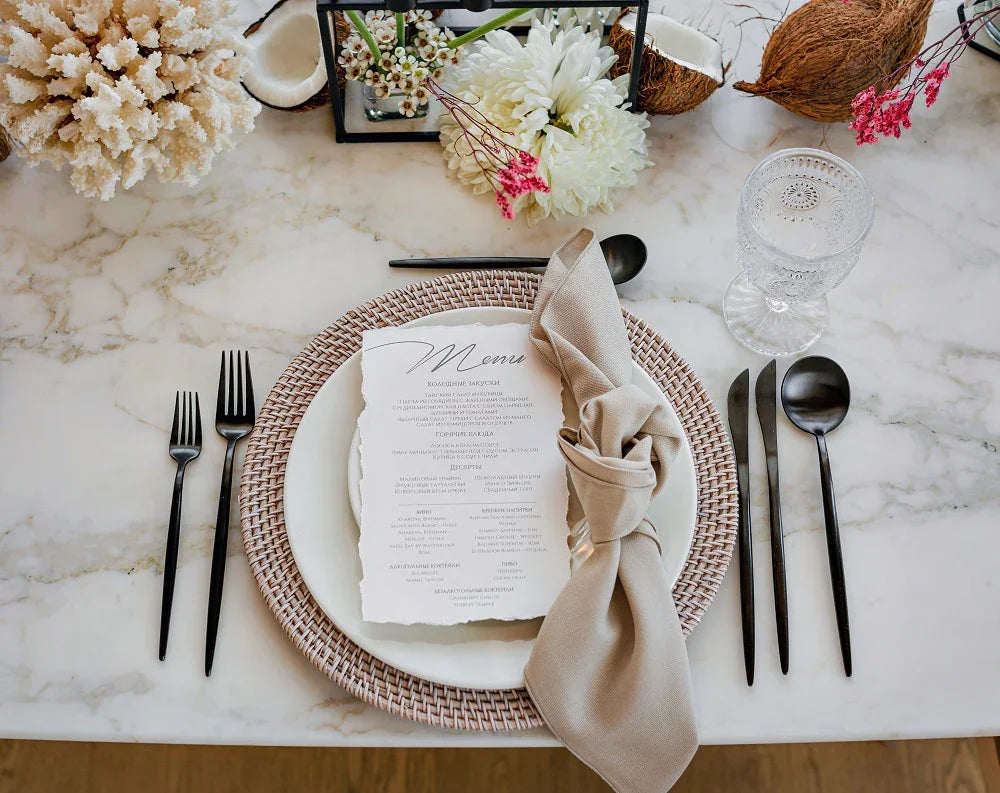 NAPKIN COTTON LINEN elegantly displayed on a plate with silverware, showcasing its premium texture, perfect for elevating any event setting.
