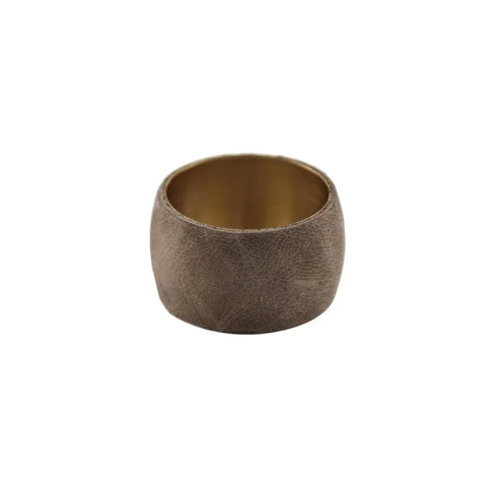 Leather wrap napkin ring with gold rim and hole detail.