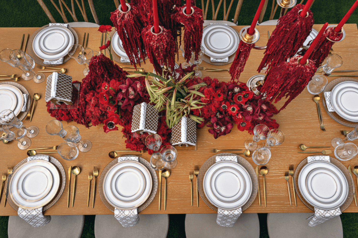 A table set with numerous plates and silverware.