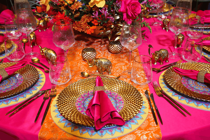 Diwali themed tablescape with colourful table linens, tableware and accessories by Party Social Event Rentals Dubai.