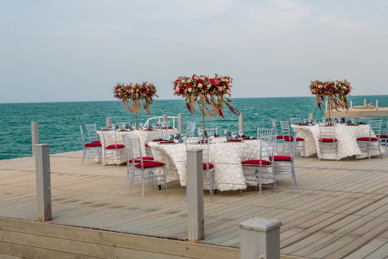 A serene wooden deck overlooking a scenic view, designed for gatherings by Party Social Dubai.