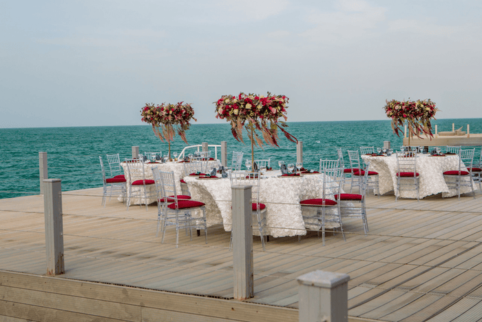 A serene wooden deck overlooking a scenic view, designed for gatherings by Party Social Dubai.