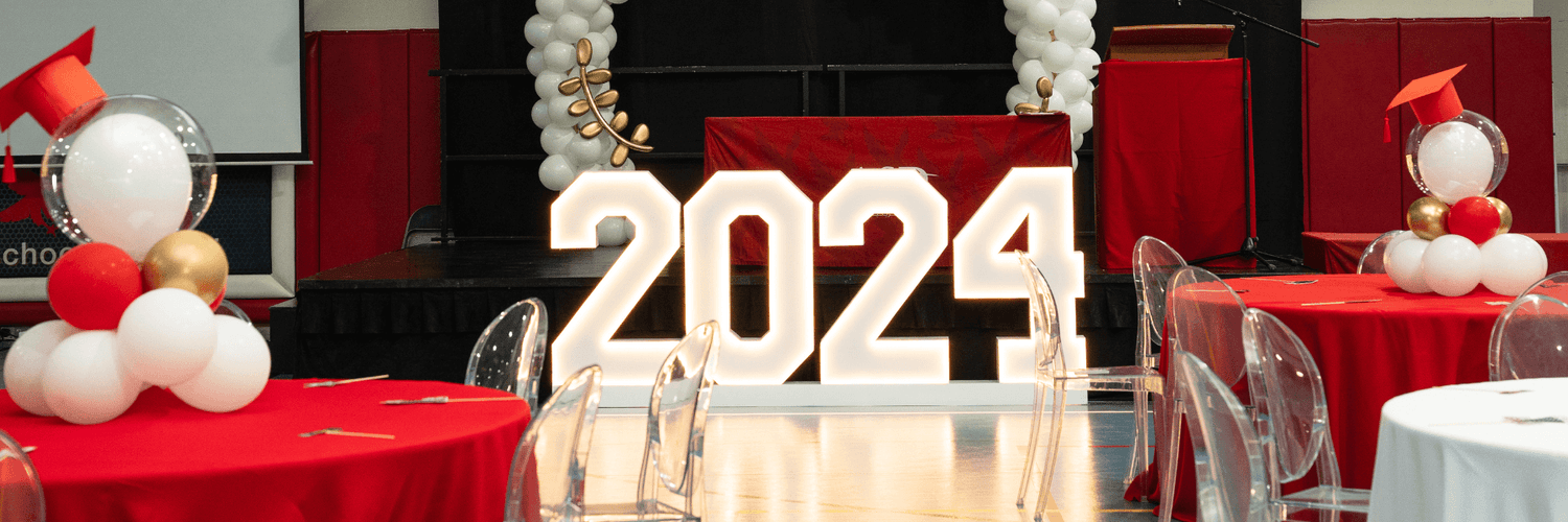 Large sign displaying "2024" in bold font for a Class of 2024 graduation celebration.