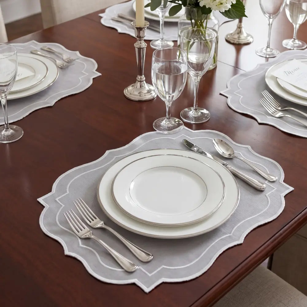 A hexagon-shaped green printed placemat with bamboo style cutlery.