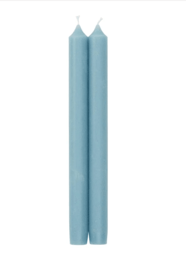 Two blue candles in a cylindrical shape