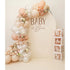 Bloom & Bliss Backdrop featuring a balloon arch with faux-florals and acrylic BABY blocks, perfect for baby showers or special occasions.