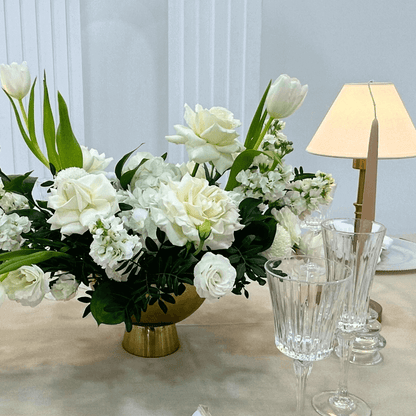 Sand Elegance- Dining Setup featuring a flower centrepiece, wine glasses, and tableware for eight guests, showcasing elegant event essentials from Party Social.