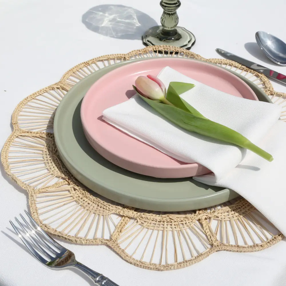 CHARGER PLATE - FLORAL RATTAN WIRE: Woven rattan-style charger with scalloped sunburst pattern, enhancing rustic or boho table settings for elegant events.
