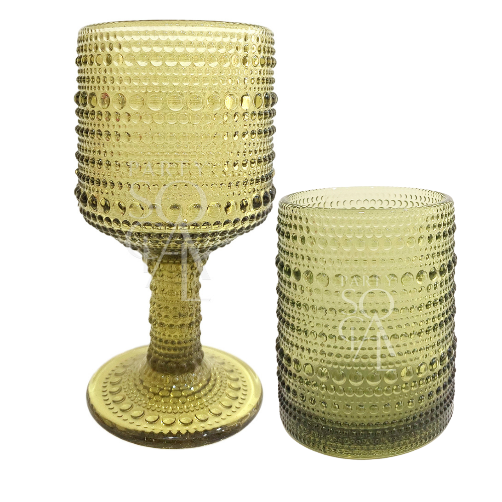Garden Bliss- Dining Setup featuring two close-up glasses with bubbles, part of an elegant table setting for eight guests.
