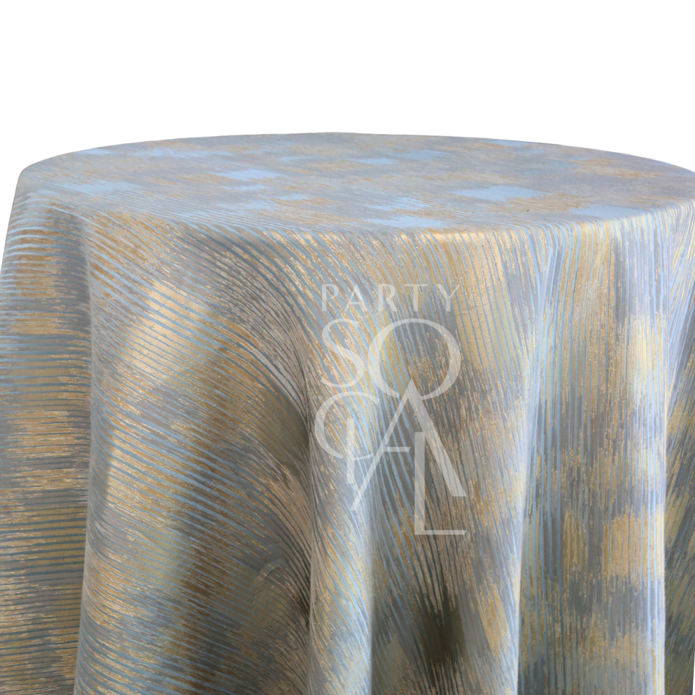 CELESTIAL HORIZON TABLECLOTH on a round table, featuring textured brush-stroke patterns in muted tones, creates an ethereal atmosphere, ideal for elegant party settings.
