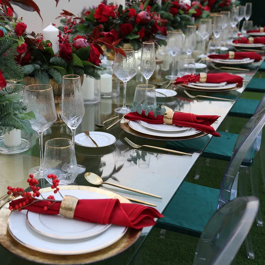 GOLD RIMMED GEOMETRIC GLASSES set on a table with red flowers and dishware, ideal for enhancing premium event settings with elegance.