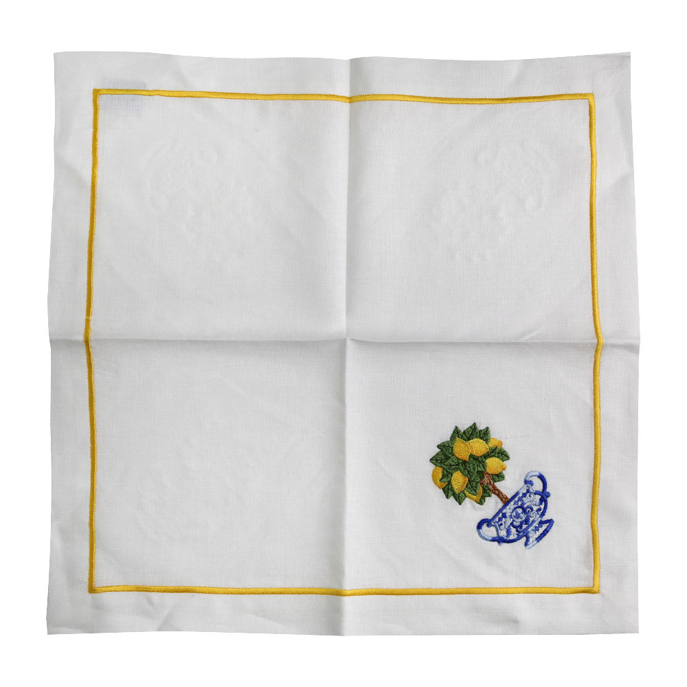 A white linen dinner napkin with yellow trim, perfect for elegant table setups. Sold in a pack of 2.