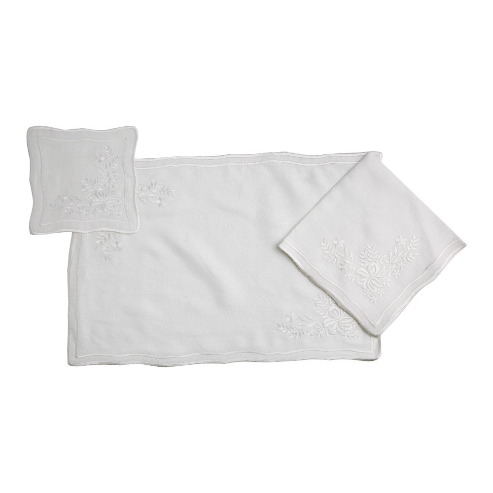 White Vintage Pure Linen Coaster - 4 per pack on a tablecloth with floral and embroidered designs
