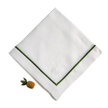 A white linen dinner napkin with a charming pineapple design.