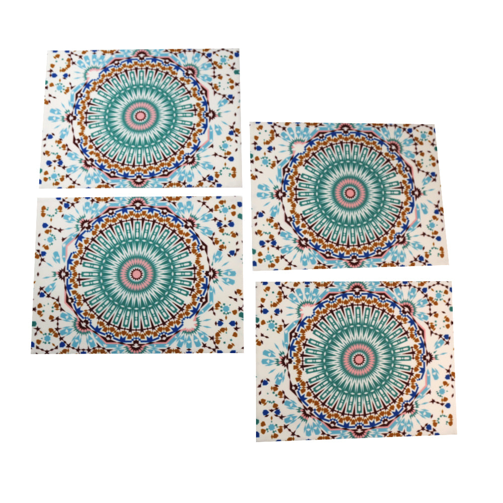 Arabesque patterned placemats for elegant table settings.