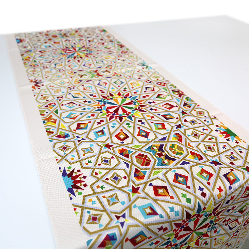 Arabesque patterned linen table runner for elegant table setups.