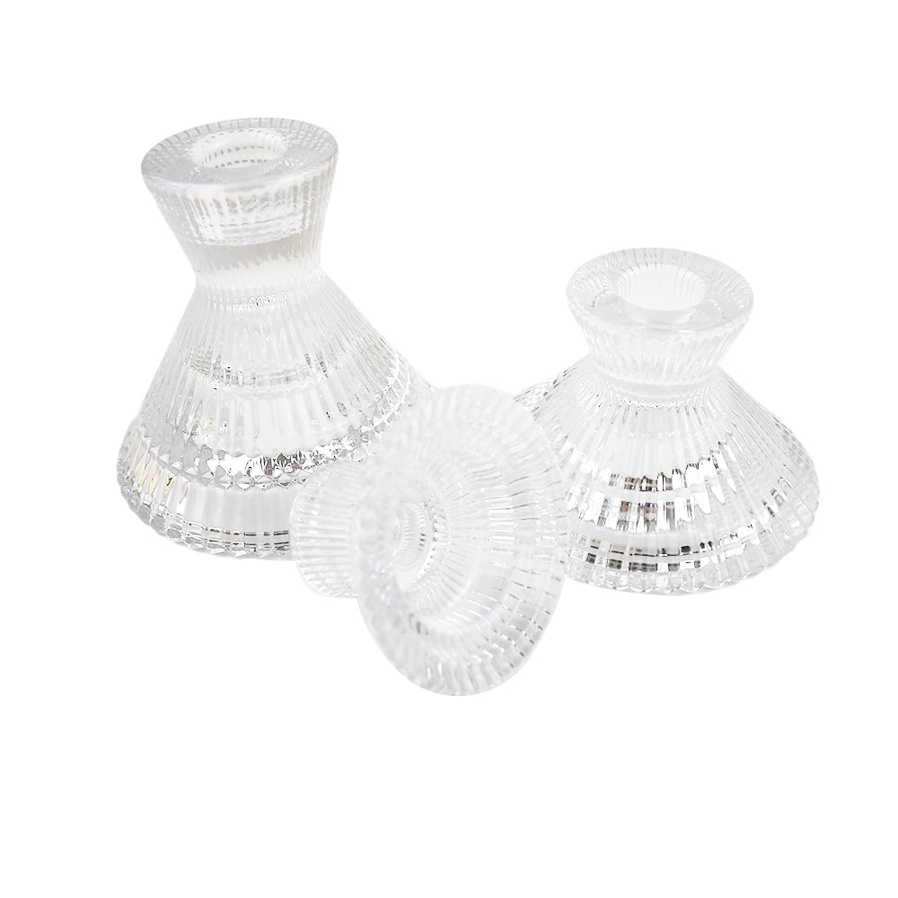 Glass candle holder with ruffles design, perfect for tealight and tapered candles, elegantly lighting up your table setup.