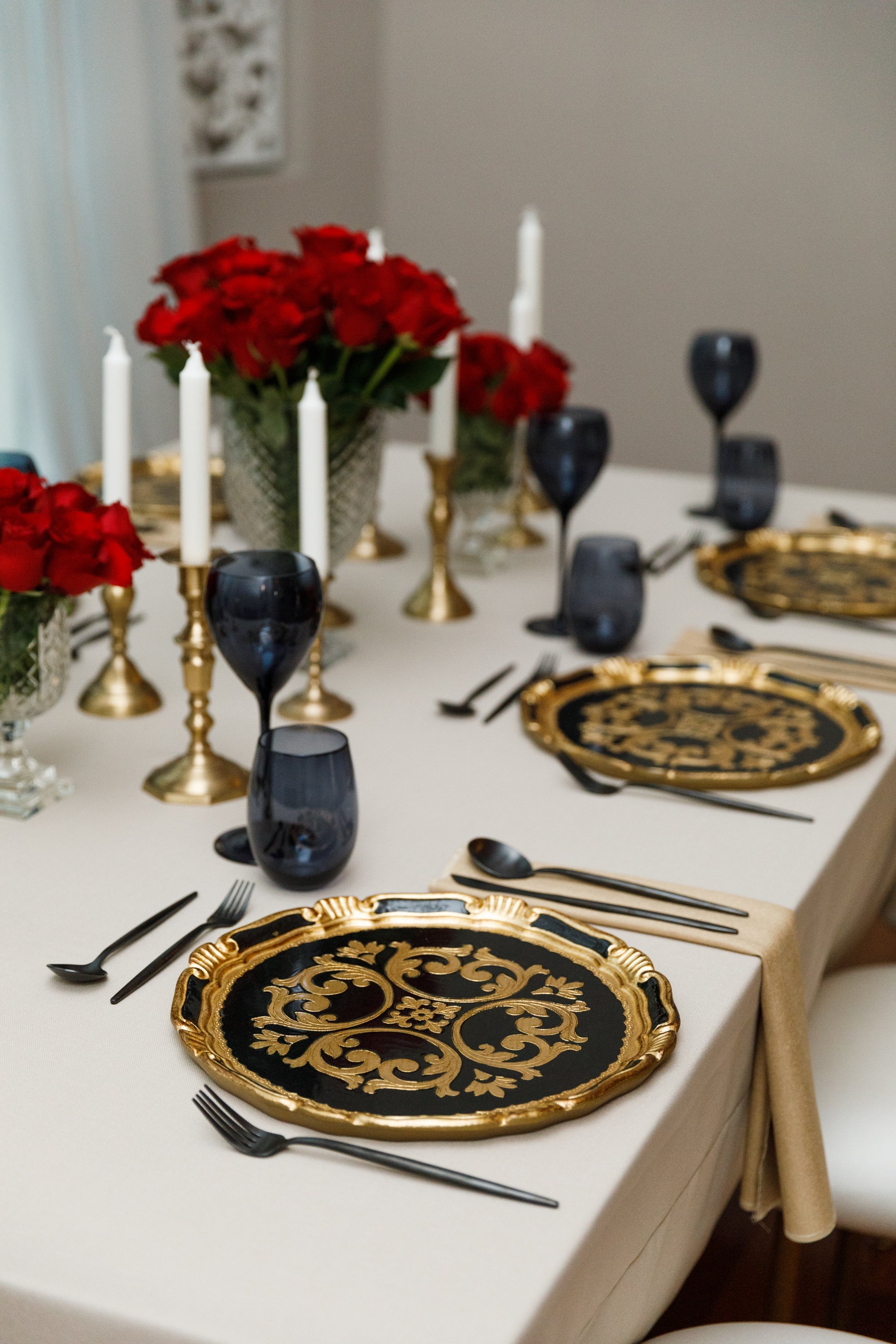 CHARGER PLATE - FLORENTINE ANTIQUE on an elegant table setup with roses and candle, showcasing its handcrafted design ideal for special events and occasions.