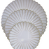 SCALLOPED LIKE PLATES: Set of three white ceramic plates with scalloped edges, showcasing a shell-like design, ideal for elegant dining occasions.