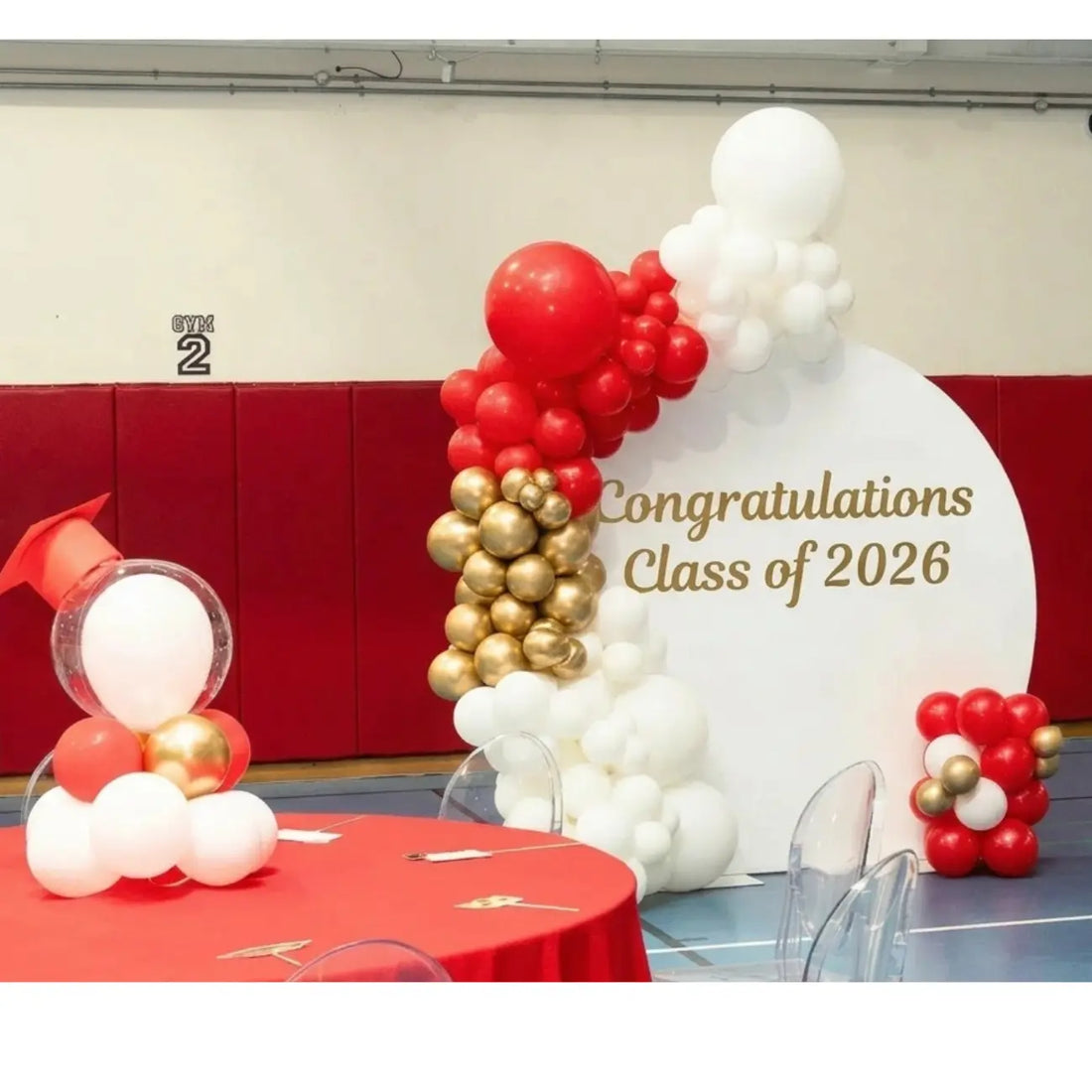 Round Wood Balloon Backdrop with festive balloon arch, celebrating Class of 2026, ideal for elevating graduation events with customizable decoration options.