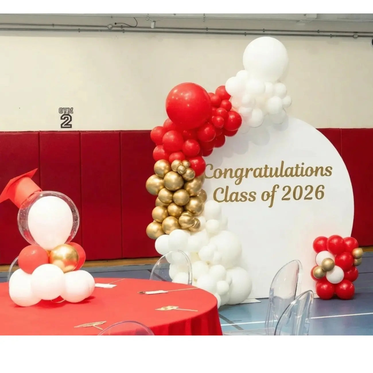 Round Wood Balloon Backdrop with festive balloon arch, celebrating Class of 2026, ideal for elevating graduation events with customizable decoration options.