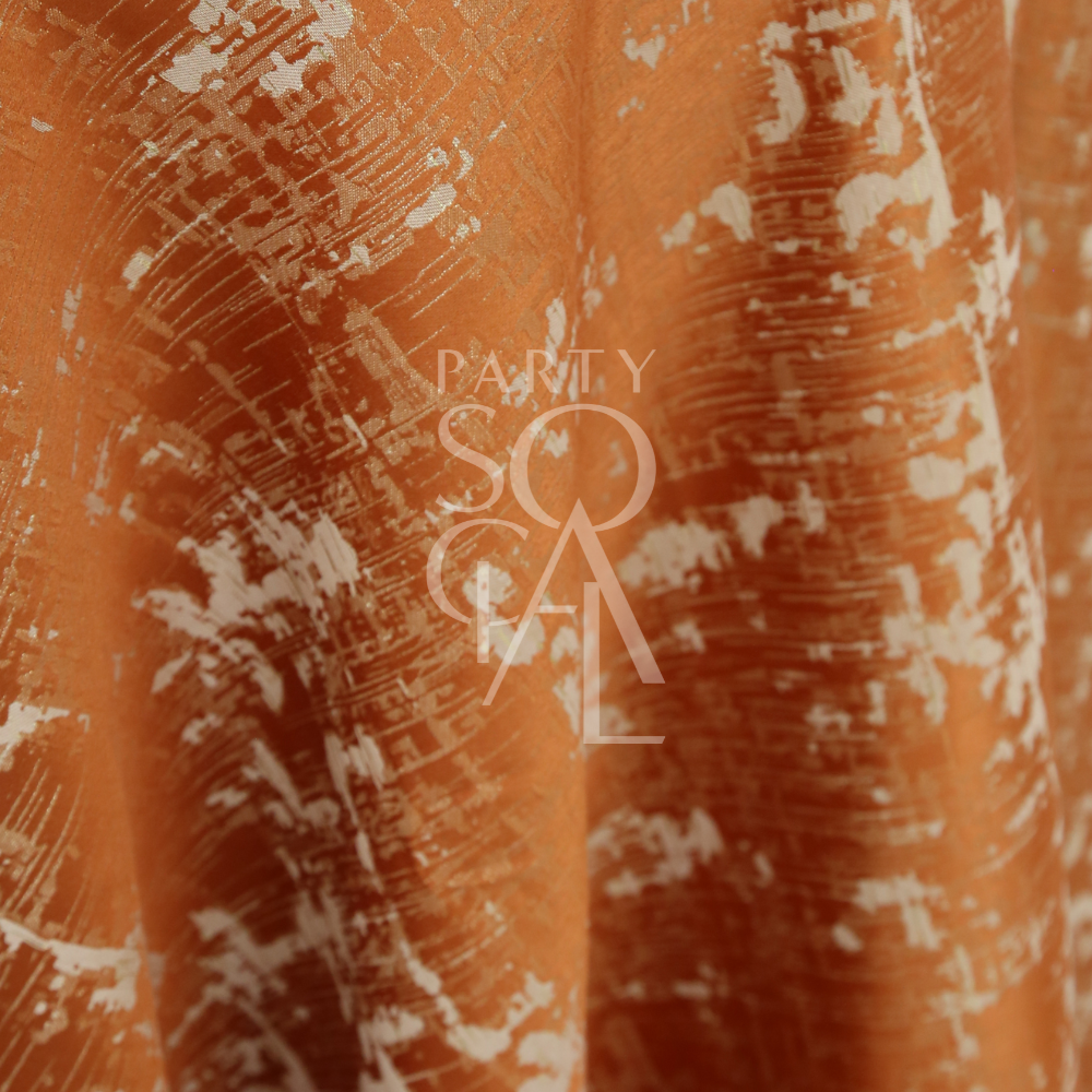 Burnt Orange Jacquard Tablecloth with distressed pattern, ideal for intimate dinners and autumn gatherings, displayed with PARTY and SOCIAL text overlay.