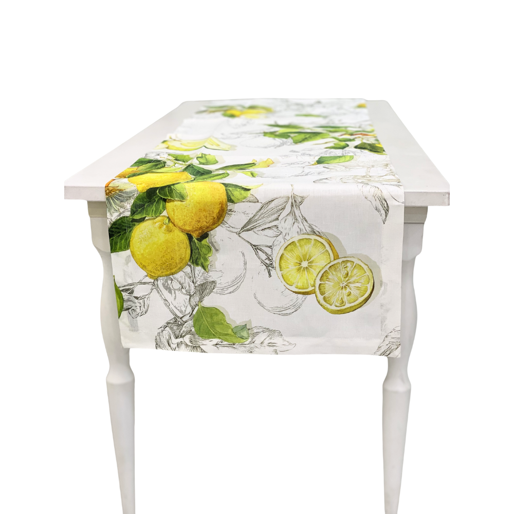 Limoncello Linen Runner-1 Each on a white wooden table, featuring bright yellow lemons and green leaves, adding elegance to festive settings from Party Social.