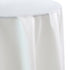 Round tablecloth satin on a table, showcasing its smooth texture, ideal for special occasions and events. Perfect for enhancing elegant party settings.