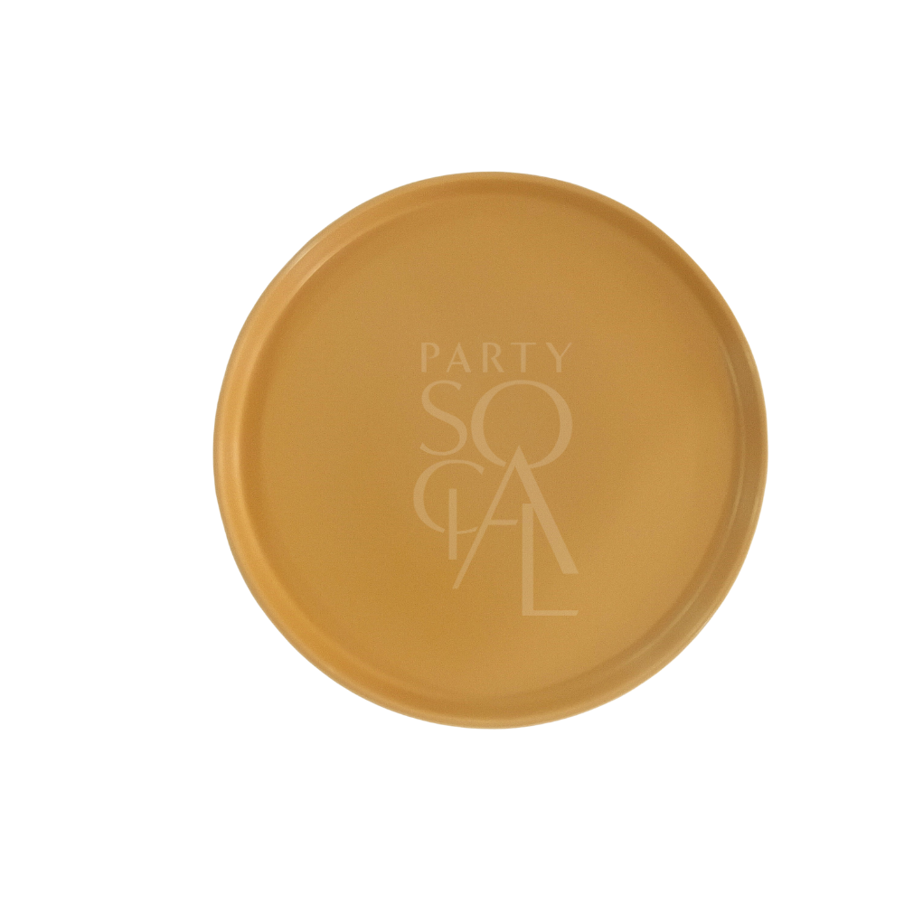 Mustard Ceramic Matte Plate featuring a PARTY SOCIAL logo, showcasing modern simplicity and natural aesthetics, ideal for enhancing any party or event setting.