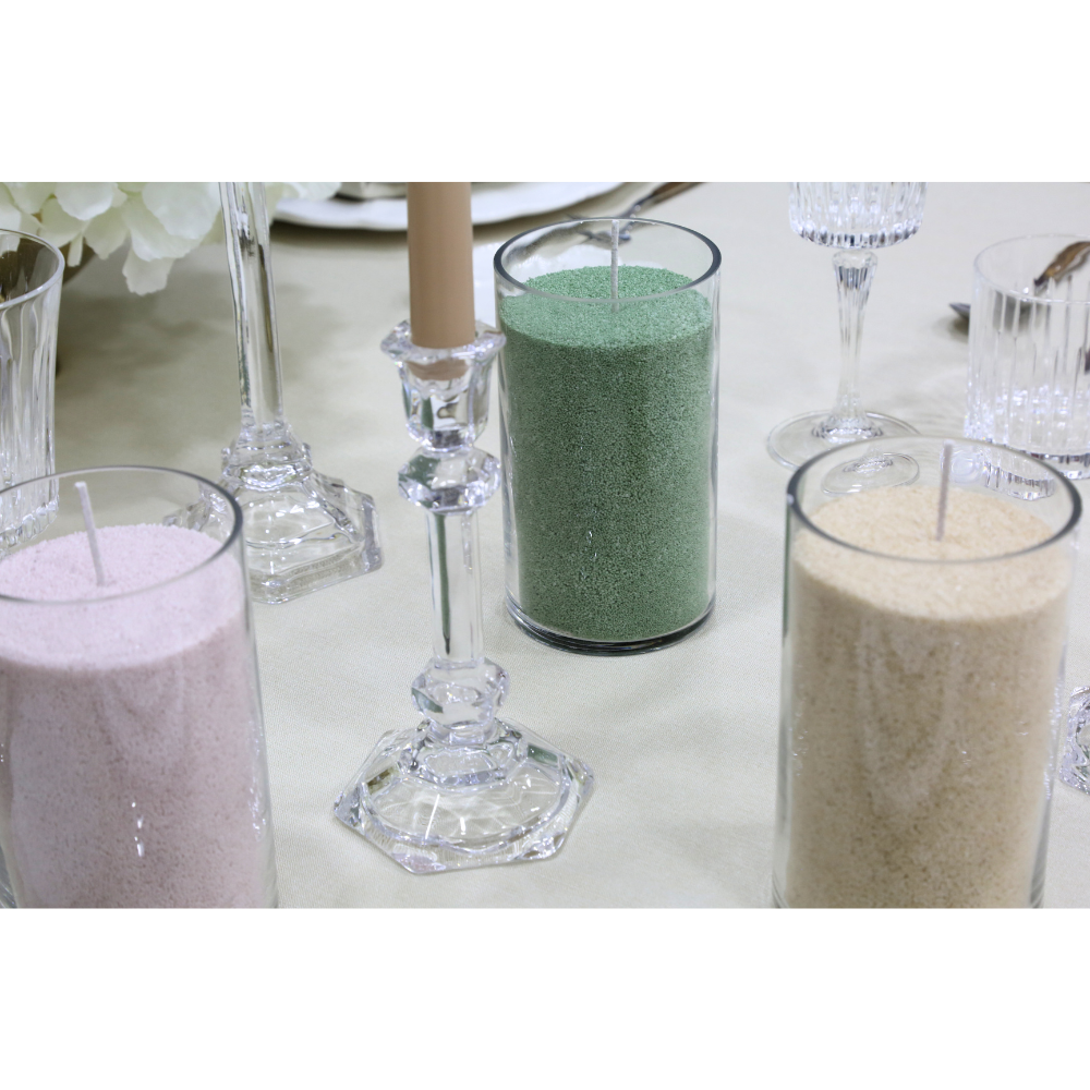 Lumen Sand Wax Candle centerpiece with glass cylinders of colored sand and candlesticks, creating a serene ambiance for events by Party Social.