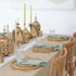 Golden Hour Iftar- Dining Setup featuring a wooden table for 8 with gold lanterns, earthenware plates, gold flatware, mint napkins, and Moroccan-style decor.