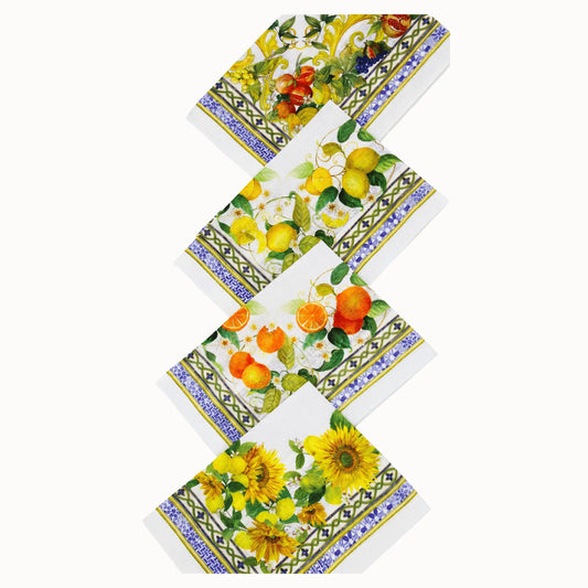 Set of four colorful napkins with floral and fruit designs on a white background