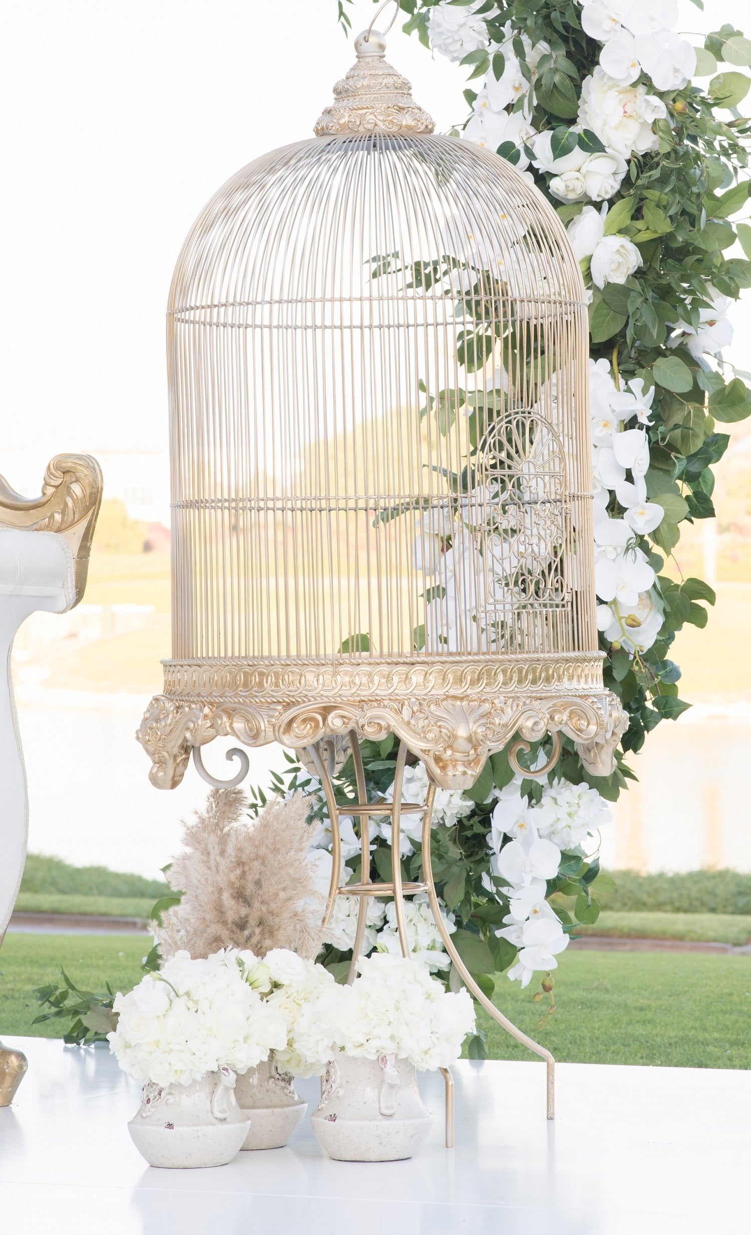 Antique Gilded Bird Cage adorned with floral accents, ideal for weddings or special events, measuring 160cm high and 70cm in diameter.