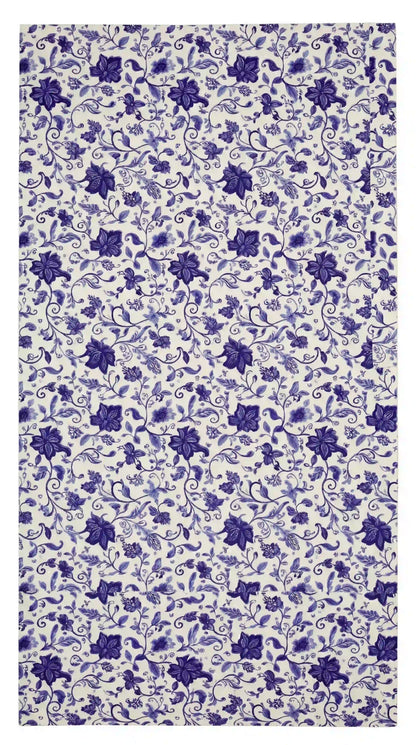Azure Garden Floral Tablecloth featuring a dense purple floral pattern on white, perfect for adding elegance to party or event settings.