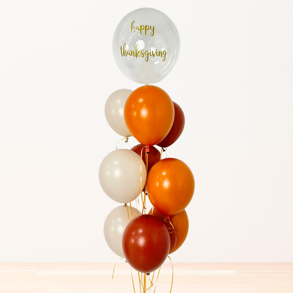 Autumn Helium Balloon Bouquet featuring assorted balloons with Happy Thanksgiving text, ideal for festive occasions. Perfectly arranged for events or celebrations.