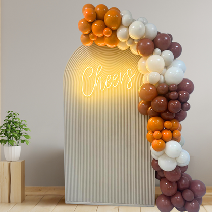 Autumn Balloon Backdrop featuring a balloon arch with a customizable LED neon sign, ideal for Thanksgiving parties from Party Social.