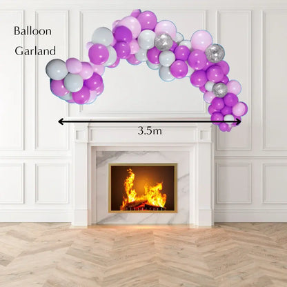 Balloon garland arch over a fireplace with dimensions indicated