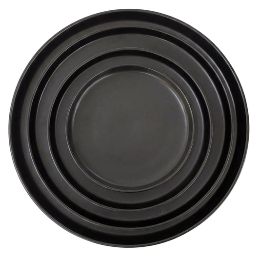 Black Ceramic Collection: A set of nested black metal baking trays in graduated sizes, perfect for enhancing elegant table settings at any event.