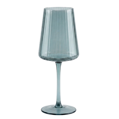 Clear blue glass wine glass on a white background