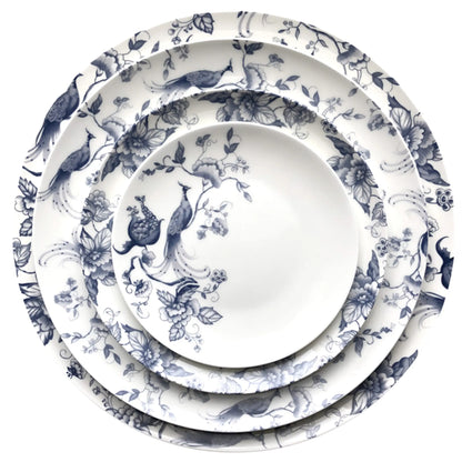Blue Peacock Collection: A set of stacked ceramic plates with blue floral and bird motifs, perfect for adding sophistication to any dining event.