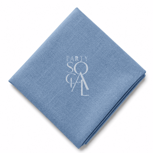 A square Blue Jeans linen napkin displayed diagonally on a clean white background.