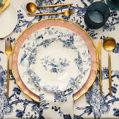 This plate features a classic blue and white porcelain-style design with intricate detailing. It is decorated with elegant bird and floral patterns, where graceful birds with flowing tails are perched among delicate branches and blossoms. The artwork is evenly spread across the surface, creating a balanced and sophisticated look.