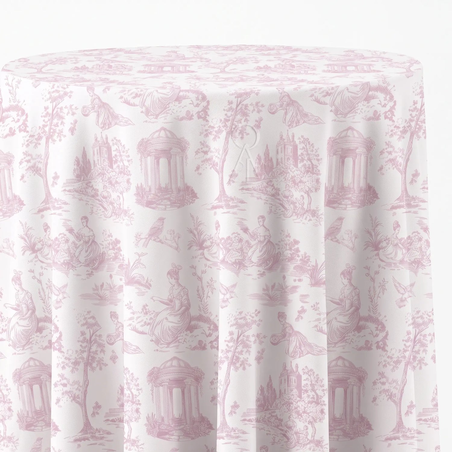 A round table covered with a white tablecloth featuring a light pink classic toile de Jouy pattern with figures, trees, and classical architecture.