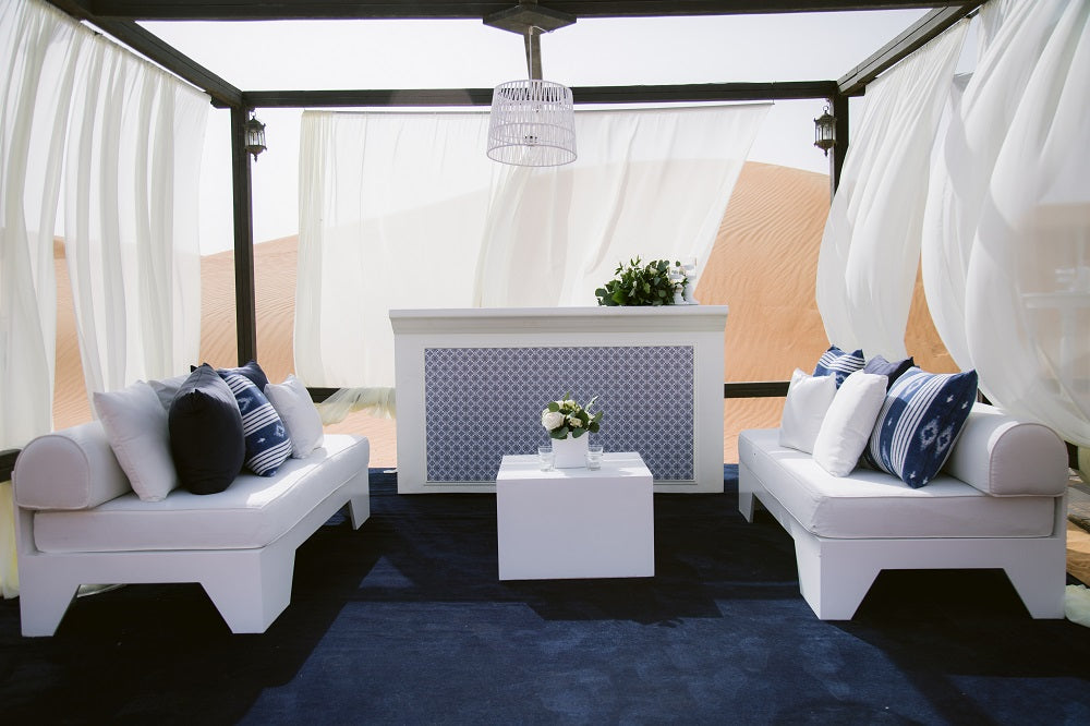 BOXY WHITE COFFEE TABLE in a tent setup, styled with glasses and a vase, ideal for events by Party Social.