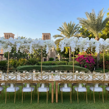 Chameleon Dining Chair with interwoven backrest at an elegant outdoor banquet table, showcasing its versatility and high-end appeal for prestigious events.