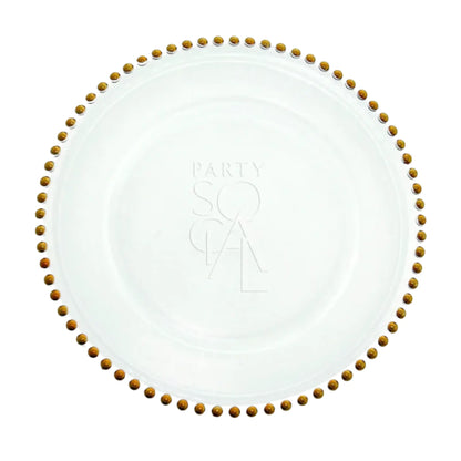 Charger Plate - Beaded: A clear glass plate with gold beaded edge, embossed with PARTY SOCIAL, ideal for elegant dining decor.