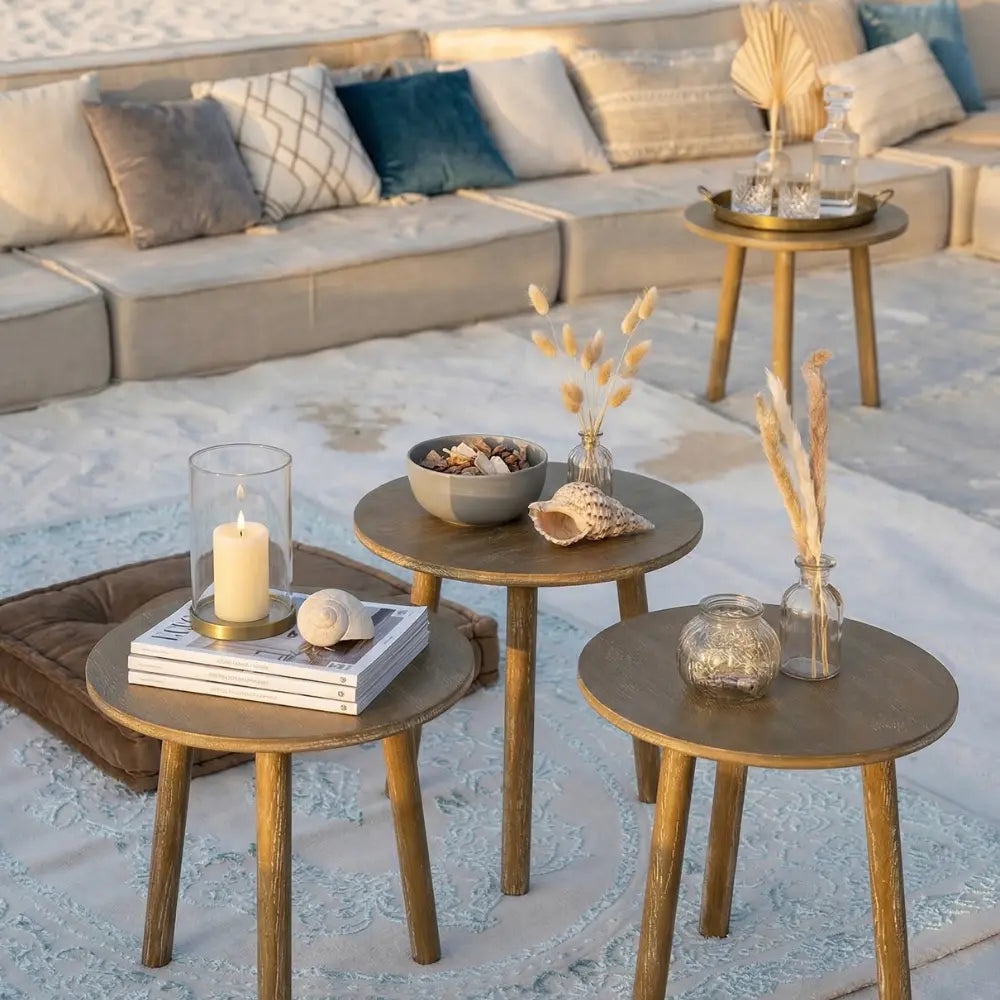 Wooden coffee table featured in a beachside lounge, adorned with decorative accents; ideal for garden or home setups, part of Party Social&