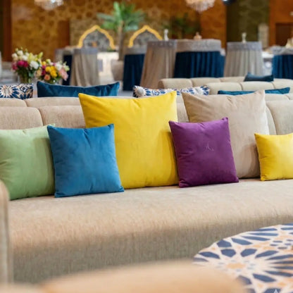 CUSHION COVER LINEN WEAVE on a neutral sofa, showcasing its premium fabric and ready-to-use design, ideal for event seating at Party Social.