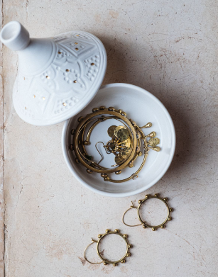 Marrakesh Medium Tajine Ceramic Bowl filled with elegant gold jewelry and accessories.